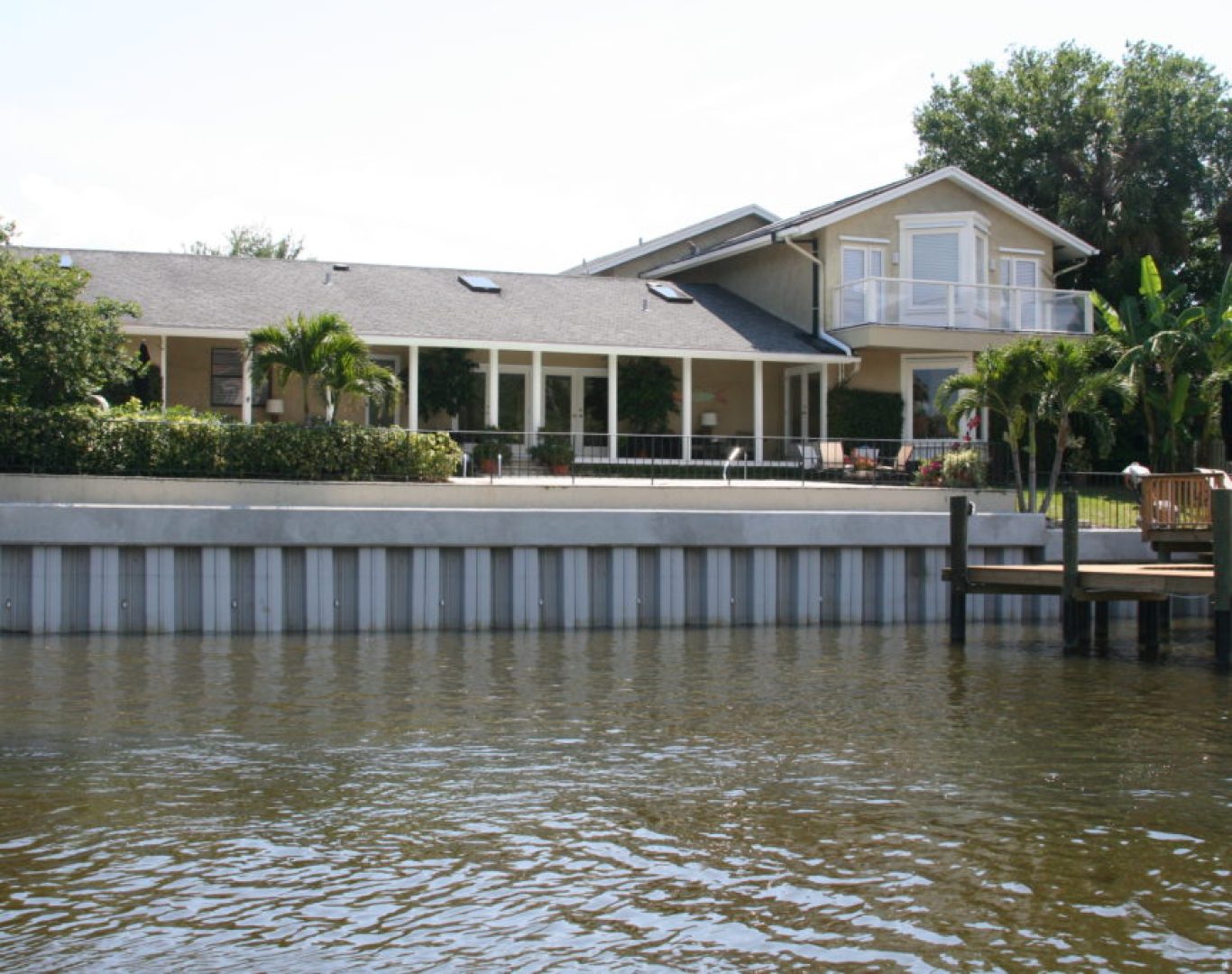 Seawall damage before repair along residential waterfront in Stuart, FL.